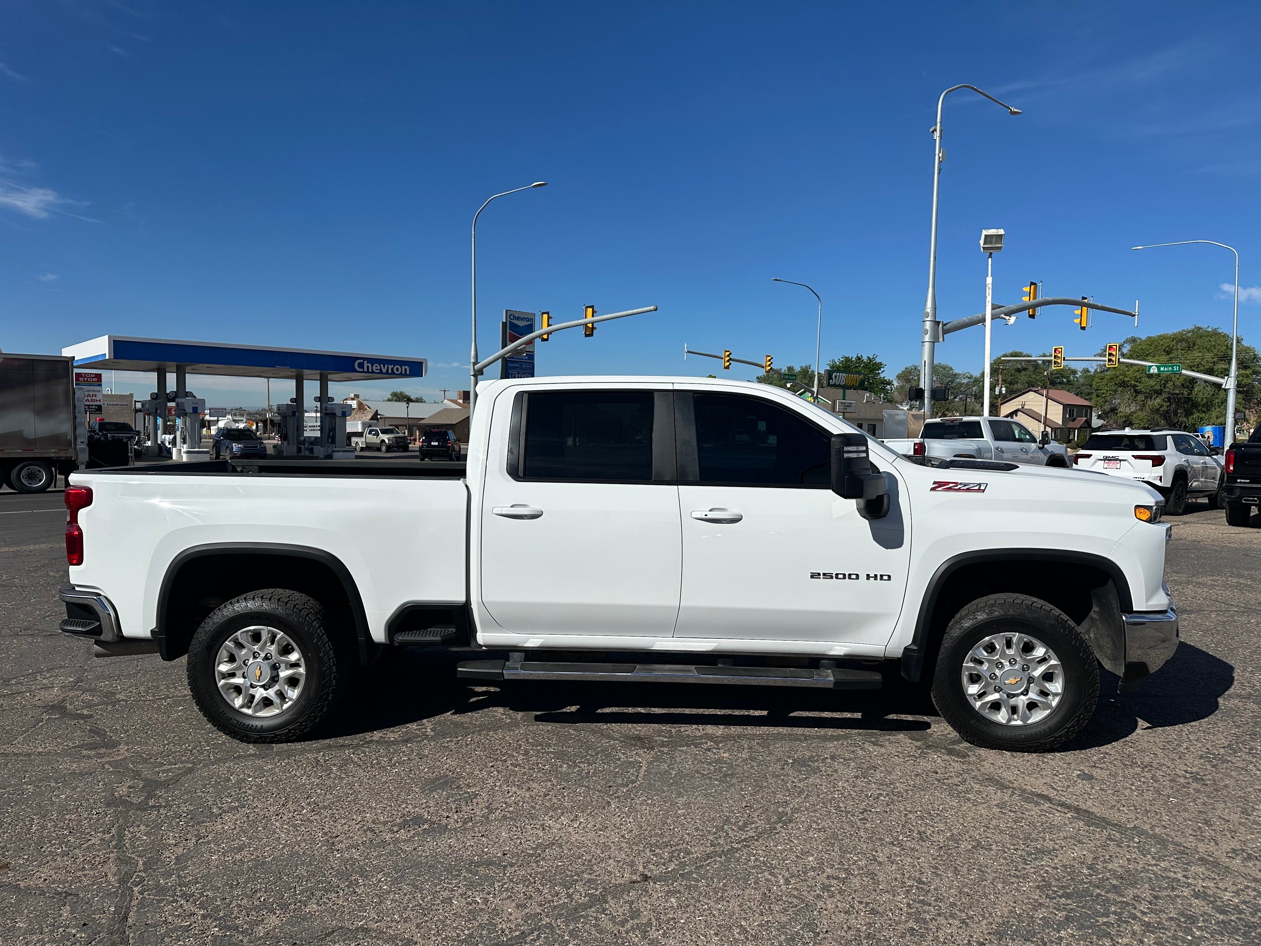 2025 Chevrolet Silverado 2500 HD LT in Summit White — front three-quarter view