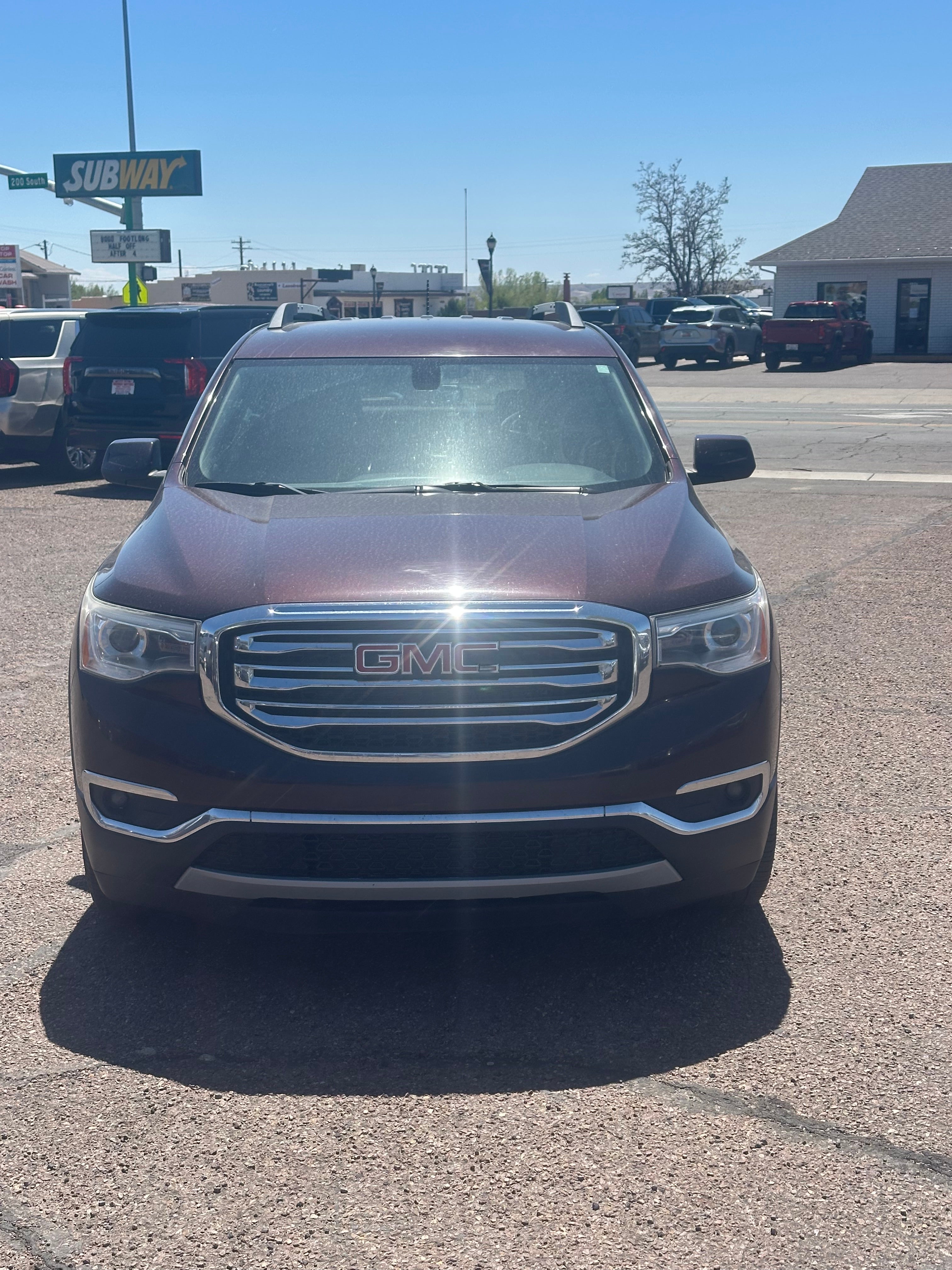 2017 GMC Acadia SLT in Black Cherry Metallic — front three-quarter view
