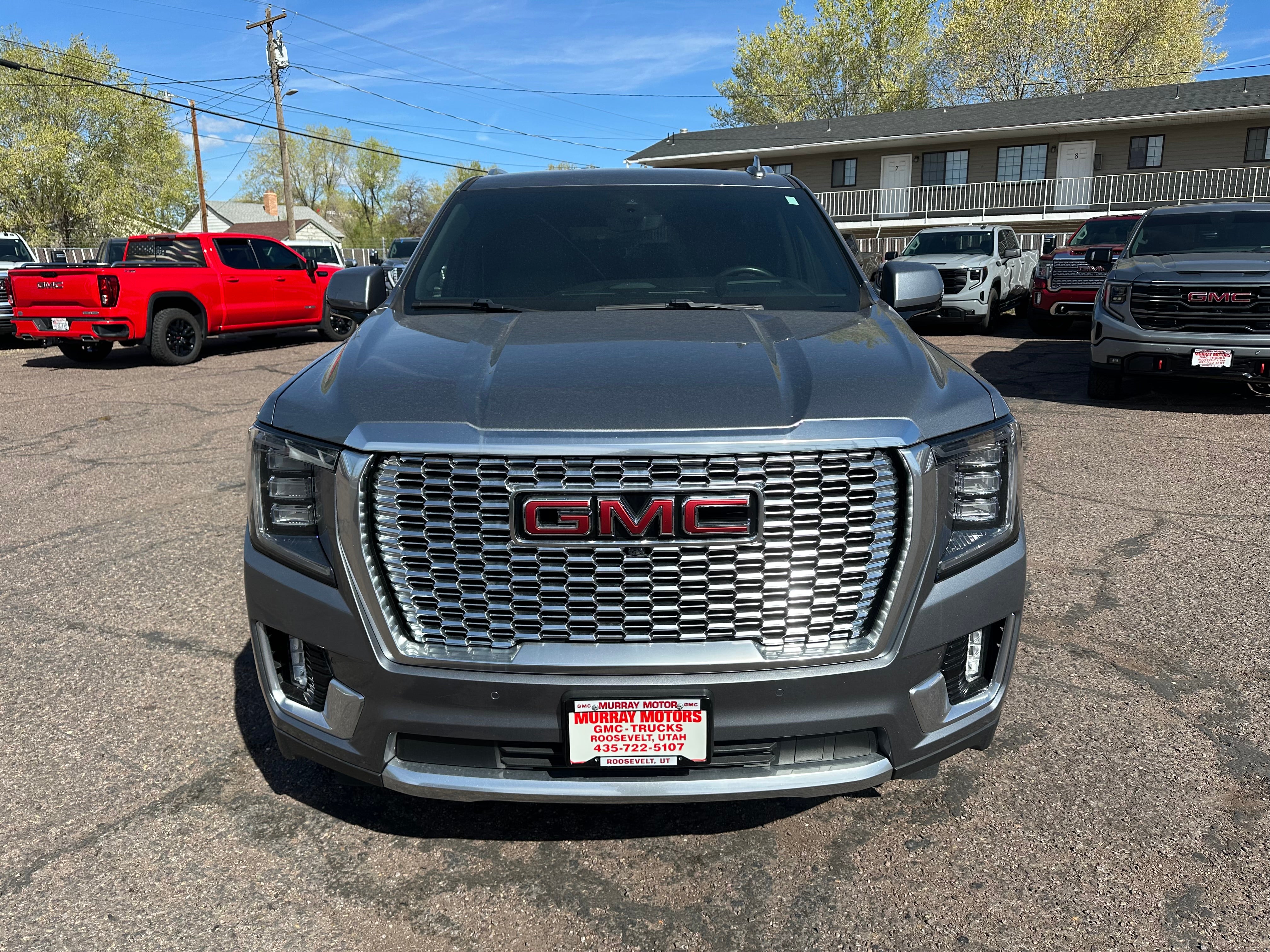 2022 GMC Yukon Denali in Satin Steel Metallic — front three-quarter view