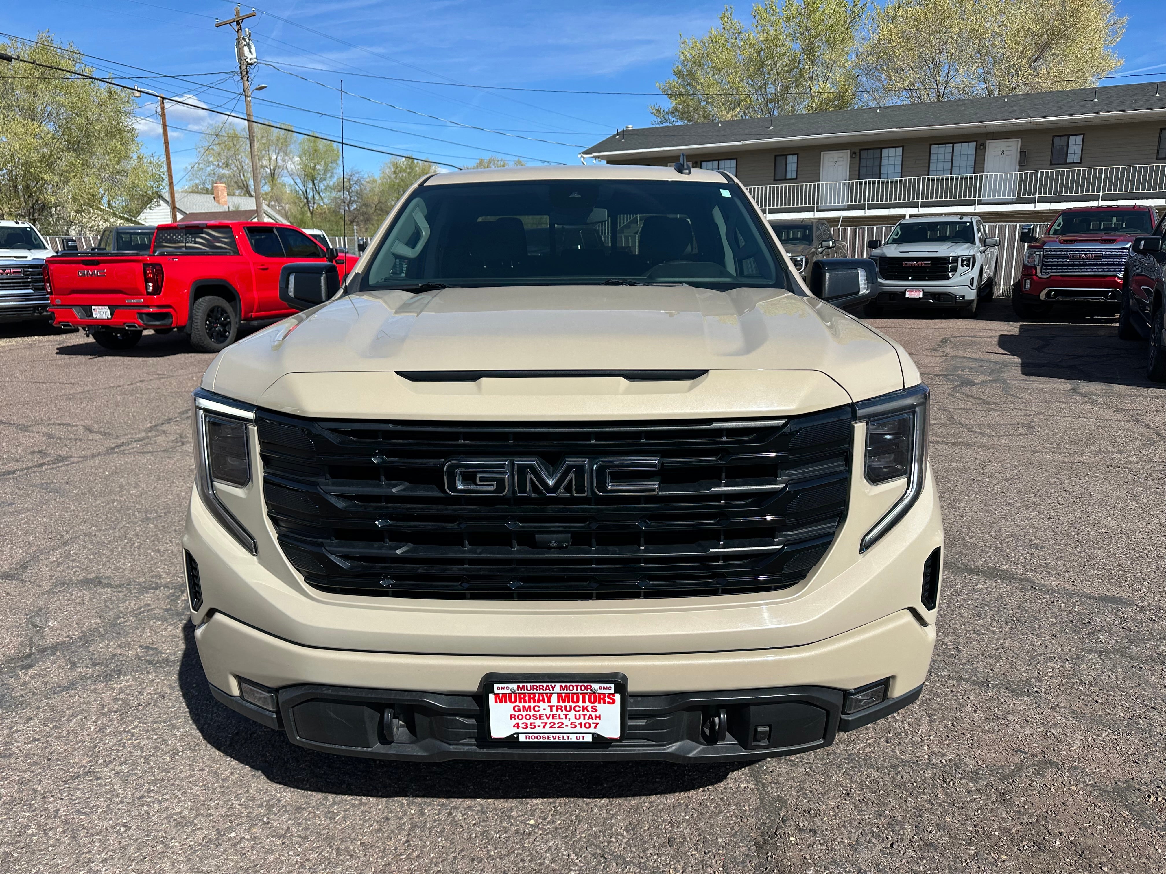 2022 GMC Sierra 1500 Elevation in Desert Sand Metallic — front three-quarter view
