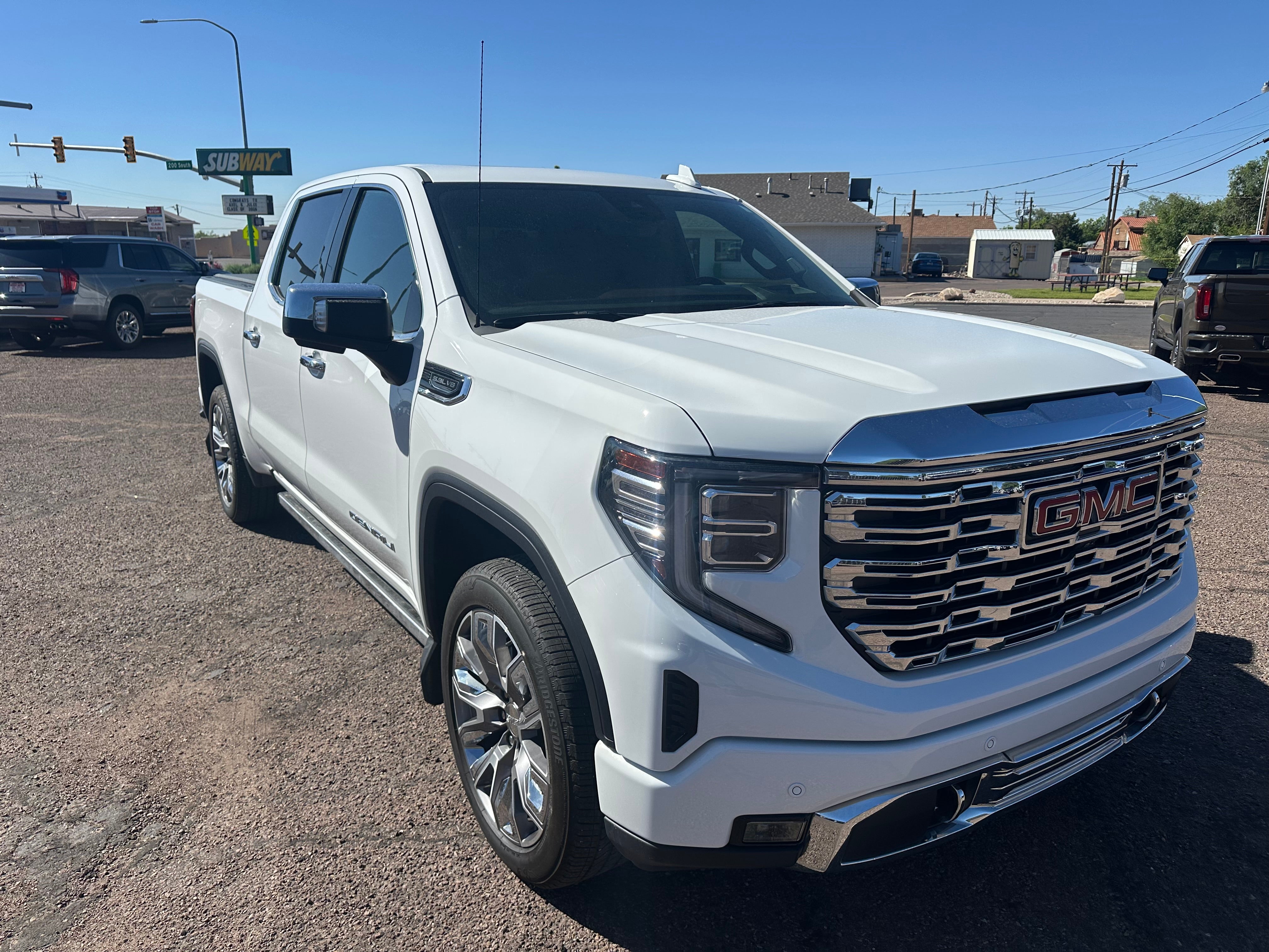 2023 GMC Sierra 1500 Denali in Summit White — front three-quarter view